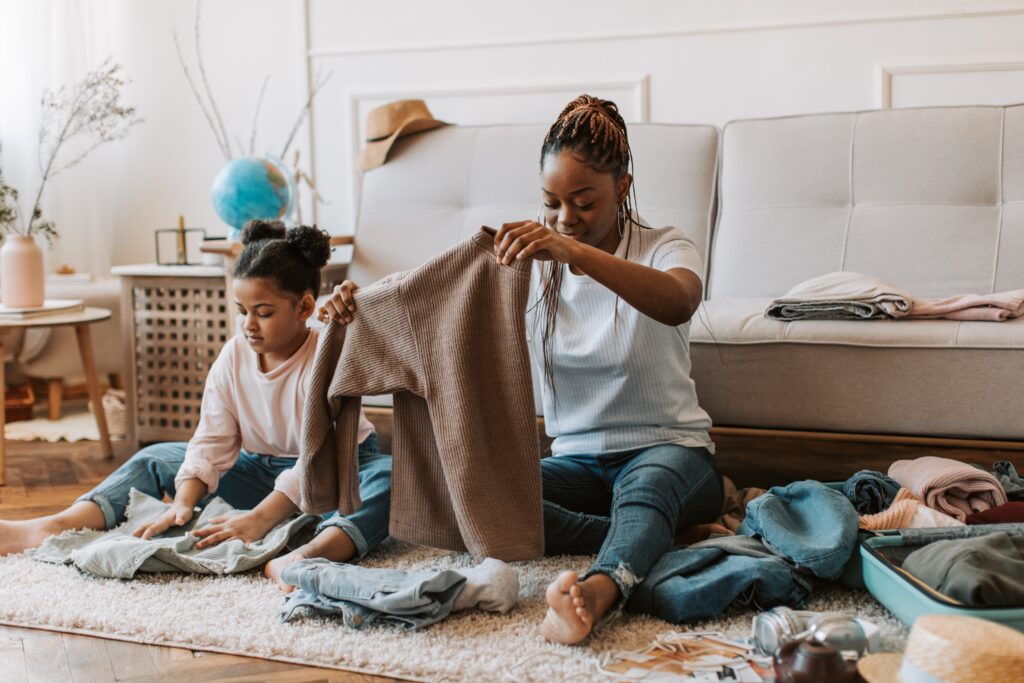 woman and child folding clothes